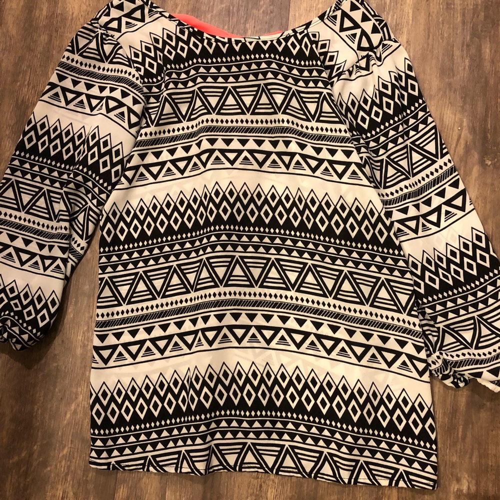 A black/white/pink children’s long sleeve shirt